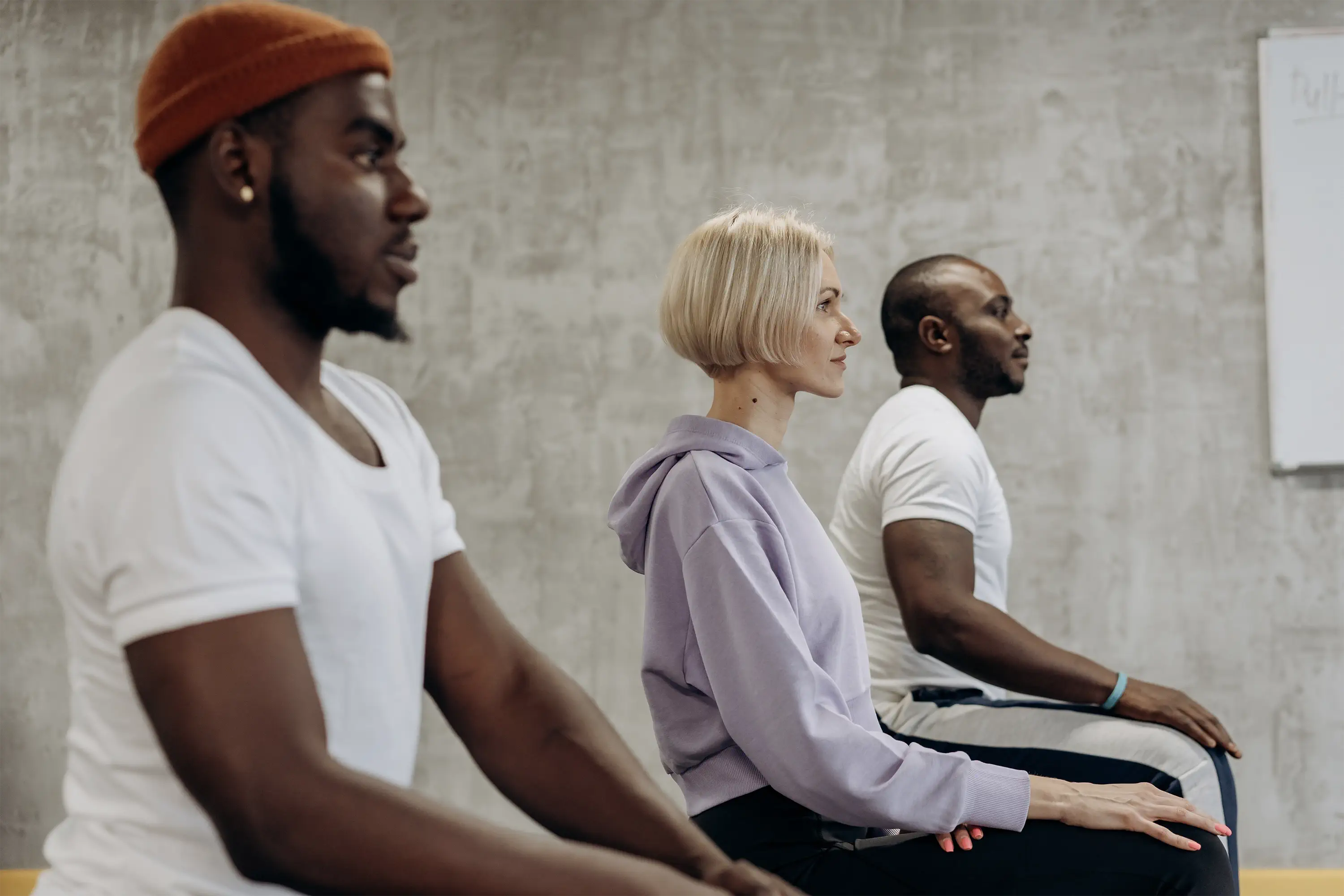 three people sitting in a row